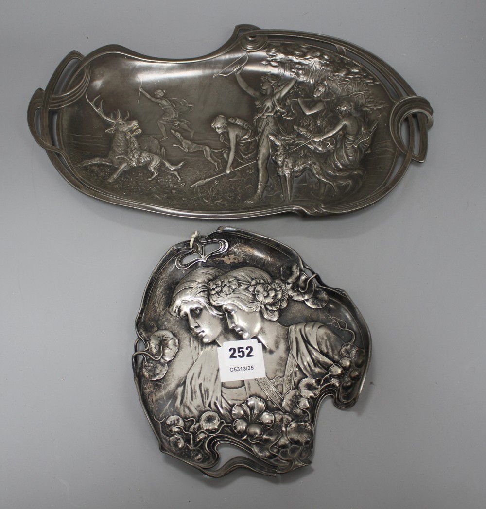A WMF pewter tray, decorated with two maidens, 23cm, and another tray decorated with Diana hunting a stag, 41cm